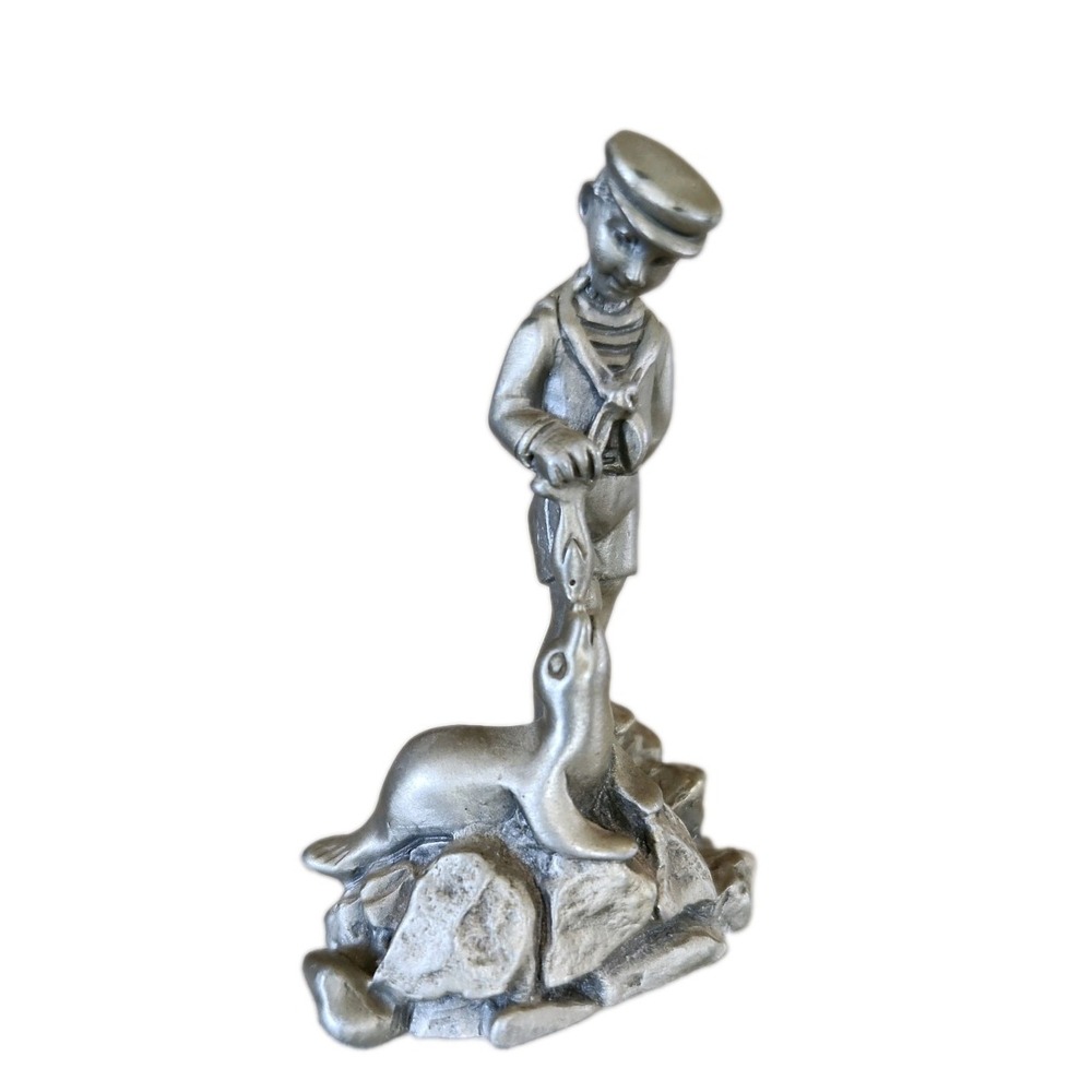 Vintage James Jewelers Pewter Figurine Boy with Seal 1982. Made In USA